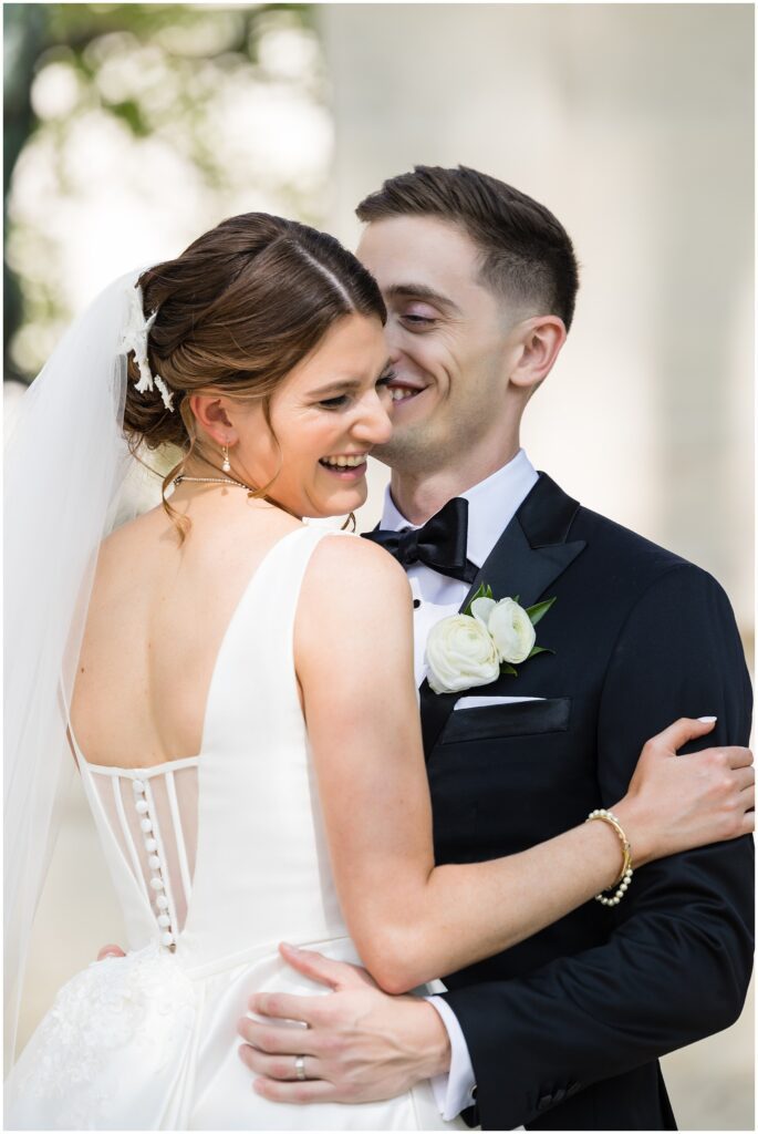 Bride and Groom embrace and smile and laugh together