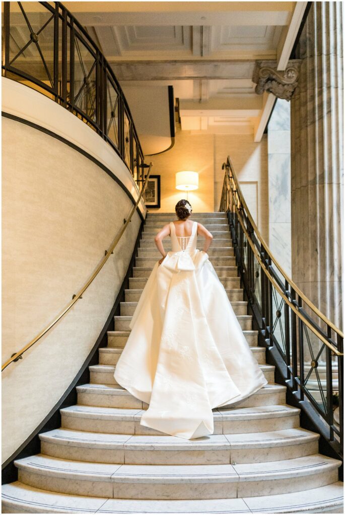 Dramatic portrait of bride ascending staircase at Philadelphia's Ritz-Carlton
