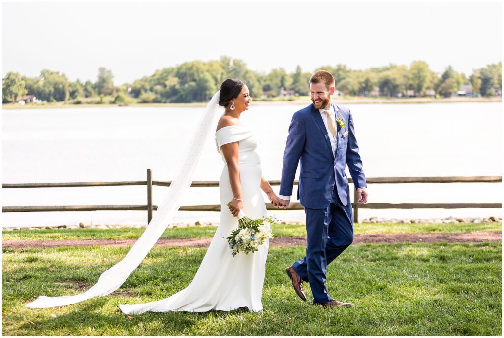 Couple walks together slowly, holding hands 