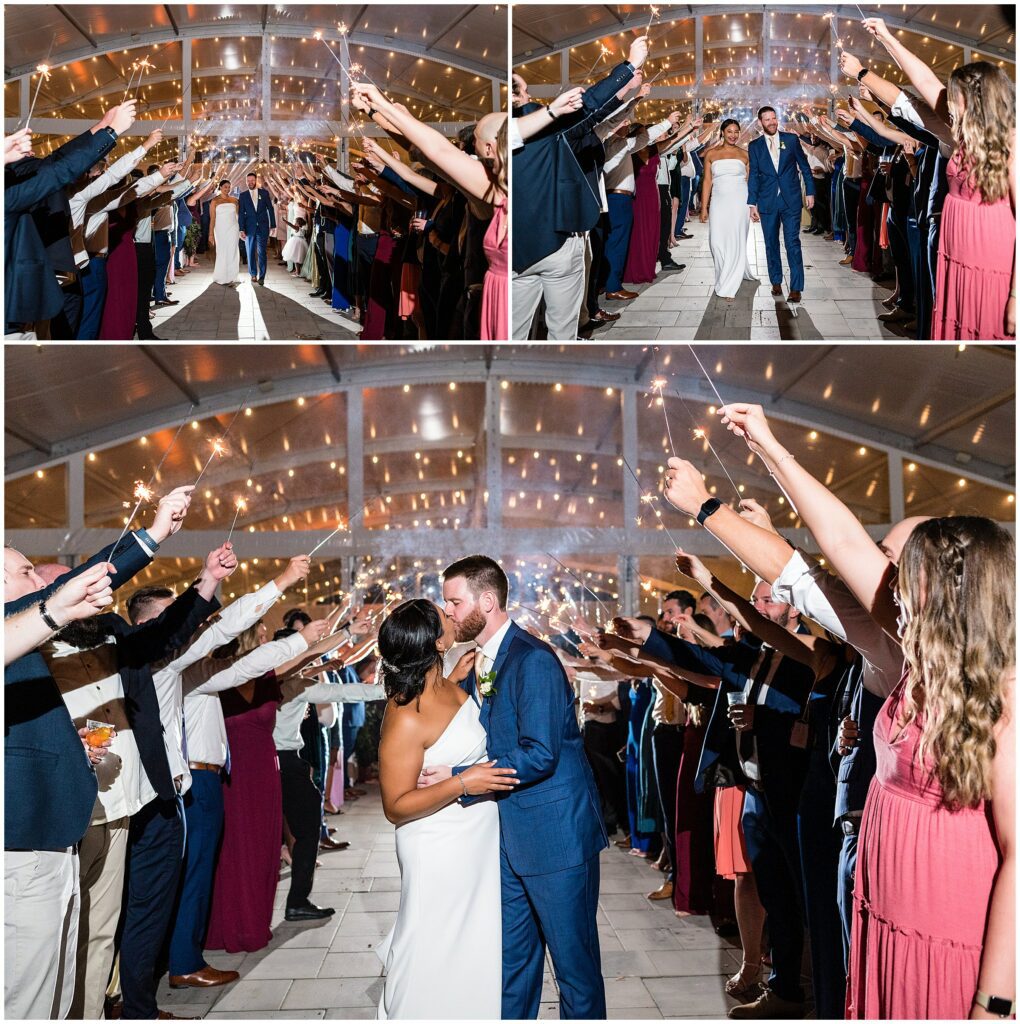 Groom and Bride exit their wedding reception to their guests holding sparklers above their heads