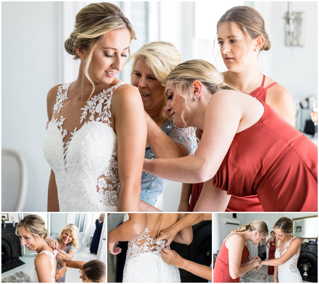 Bride has assistance buttoning her wedding dress
