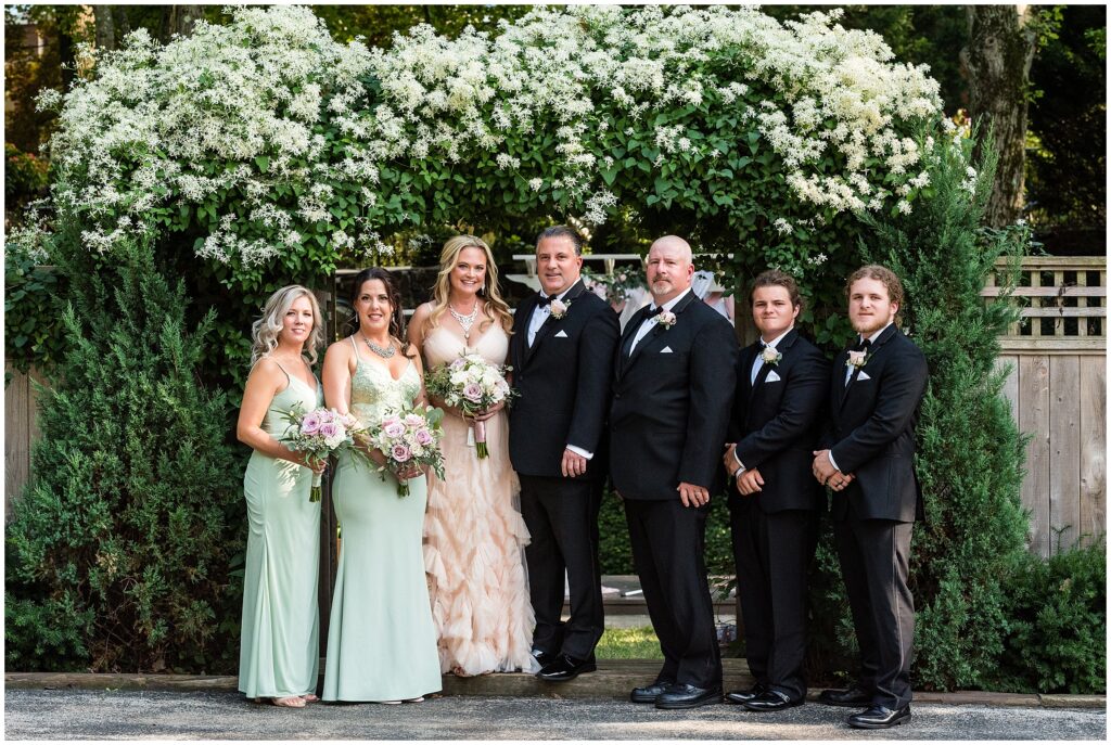 Wedding Party on either side of Bride and Groom
