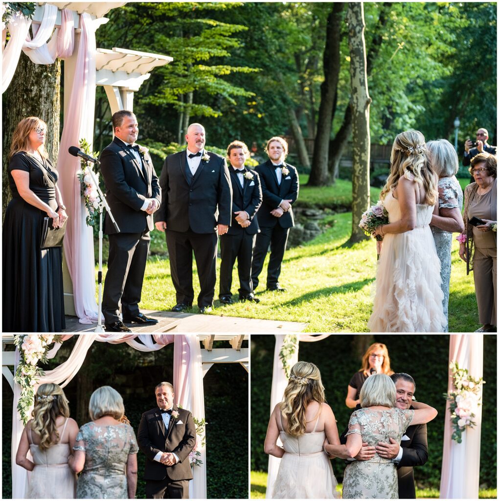 Bride and her mom processional towards groom at wedding ceremony