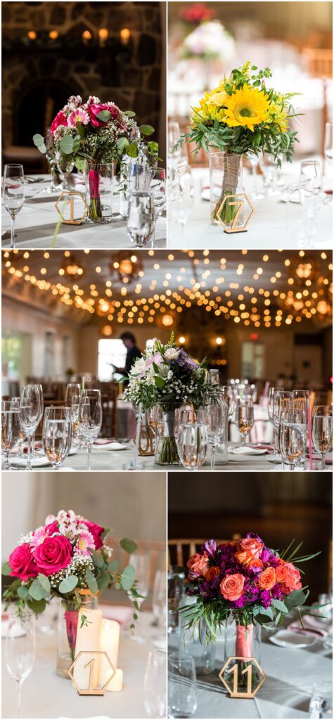 bouquets in vases near table numbers, and sparkling overhead lights for wedding reception at Pomme Radnor