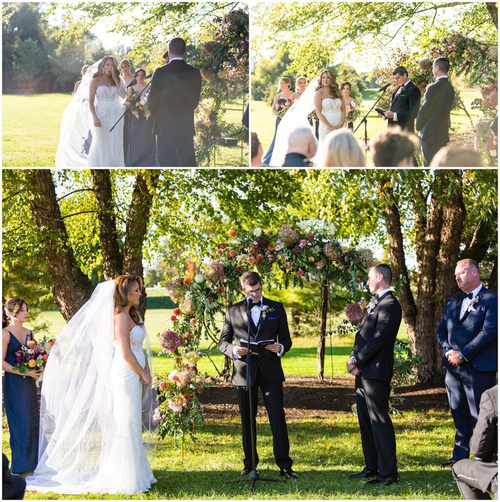 Bride and Groom share vows in front of colorful floral arch during their Rose Bank Winery wedding