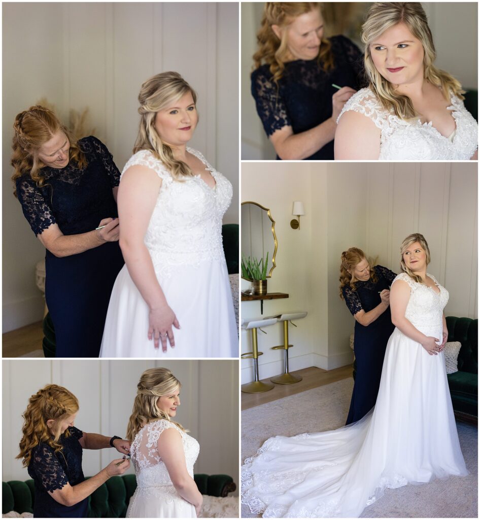 bride is assisted with buttoning up her lace back dress
