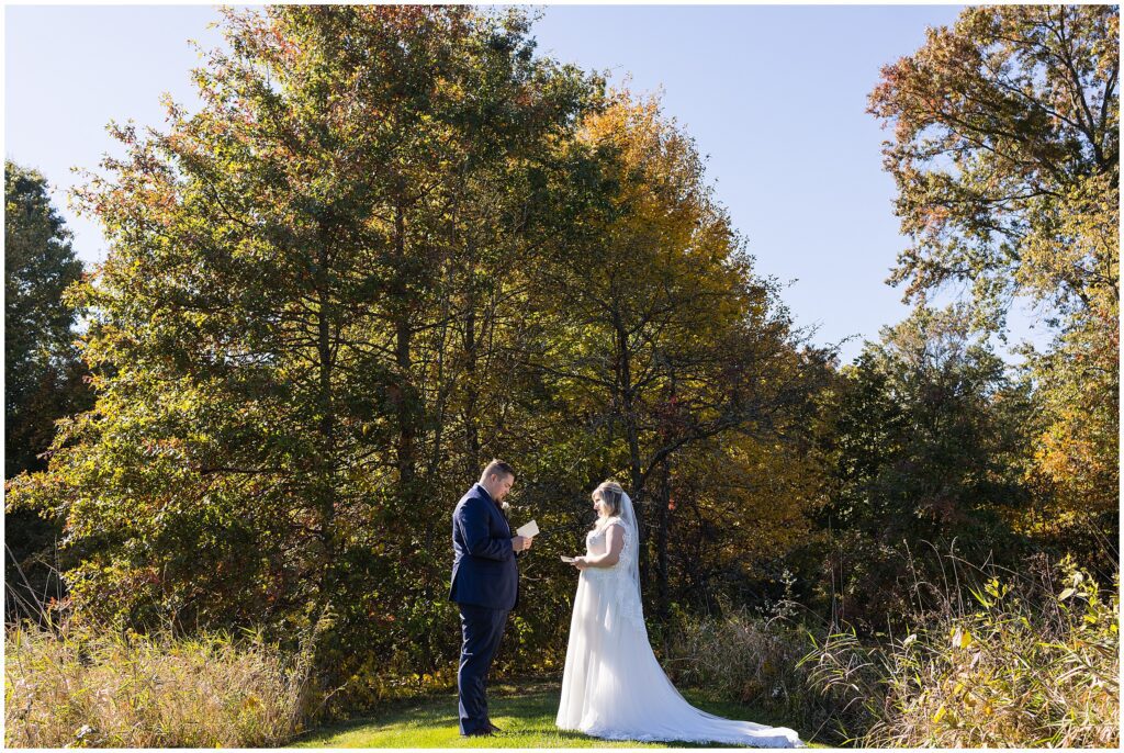 Bride and Groom share their personal vows privately before their fall wedding
