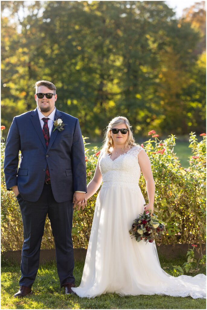 Newlyweds on wedding day with sunglasses