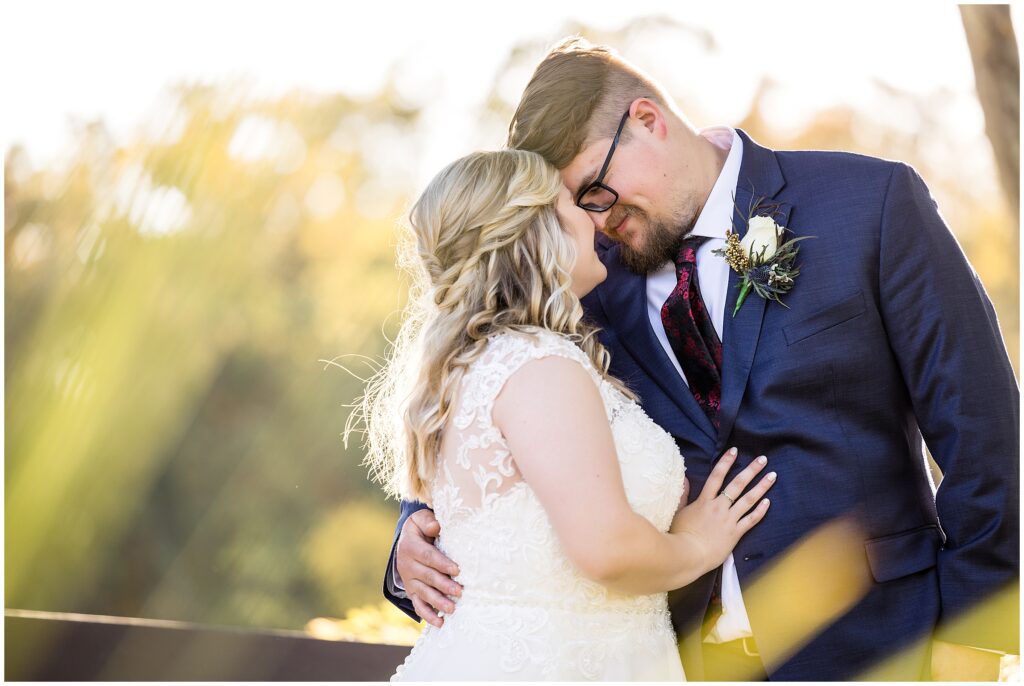 Bride and Groom share a quiet moment together during their fall wedding