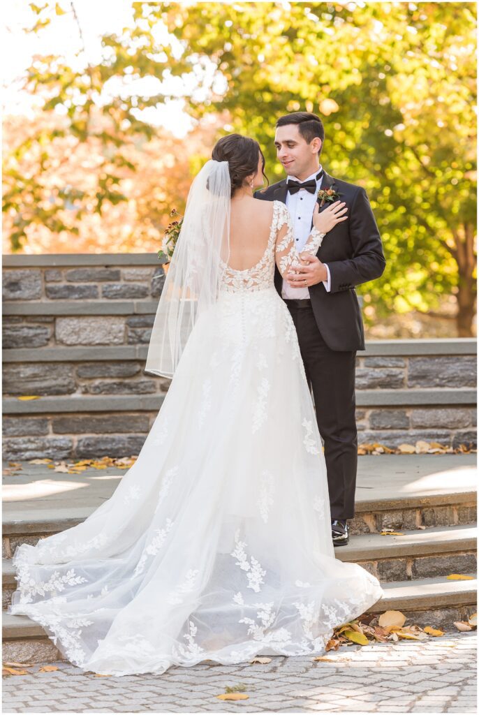 Back of custom wedding dress with embroidery details on sleeves and train of dress