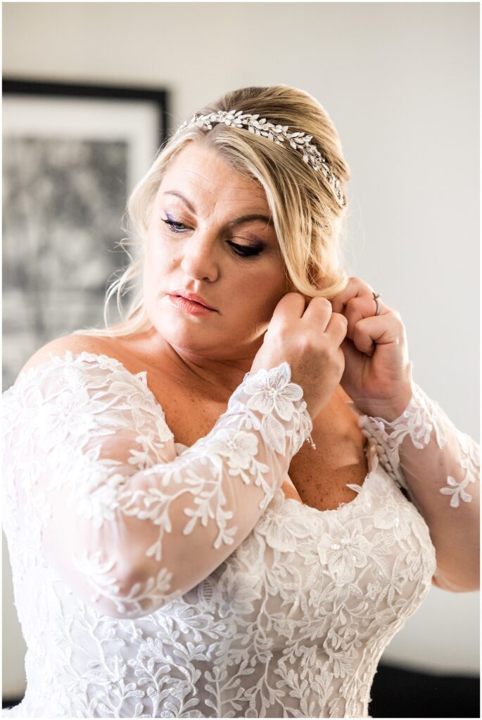 Bride adds finishing touches to wedding her day look