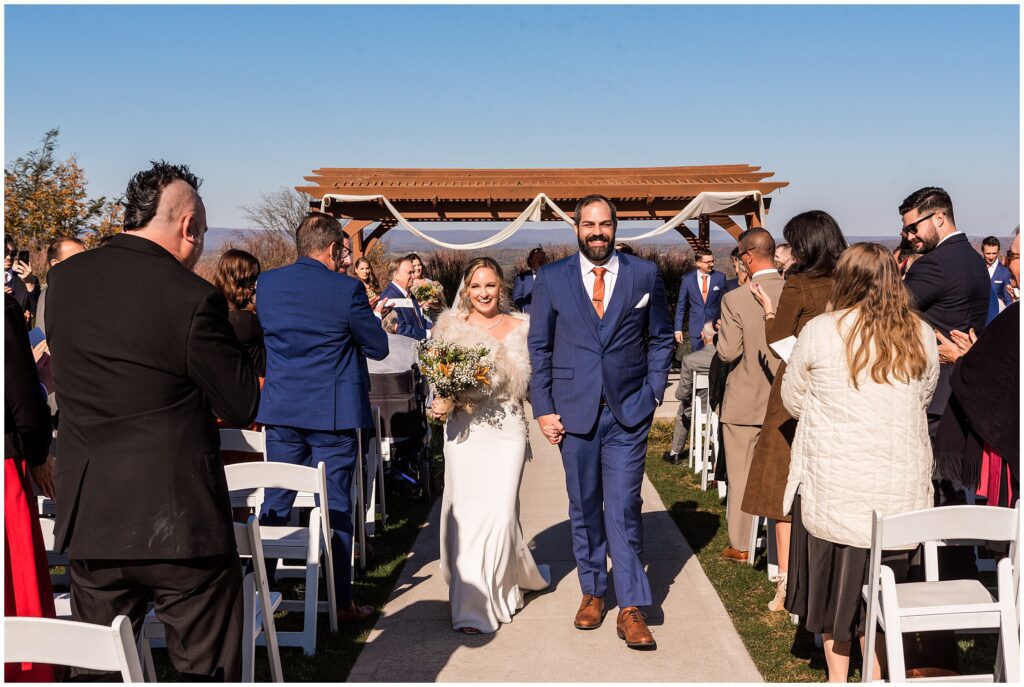 Newlywed's exit their wedding ceremony