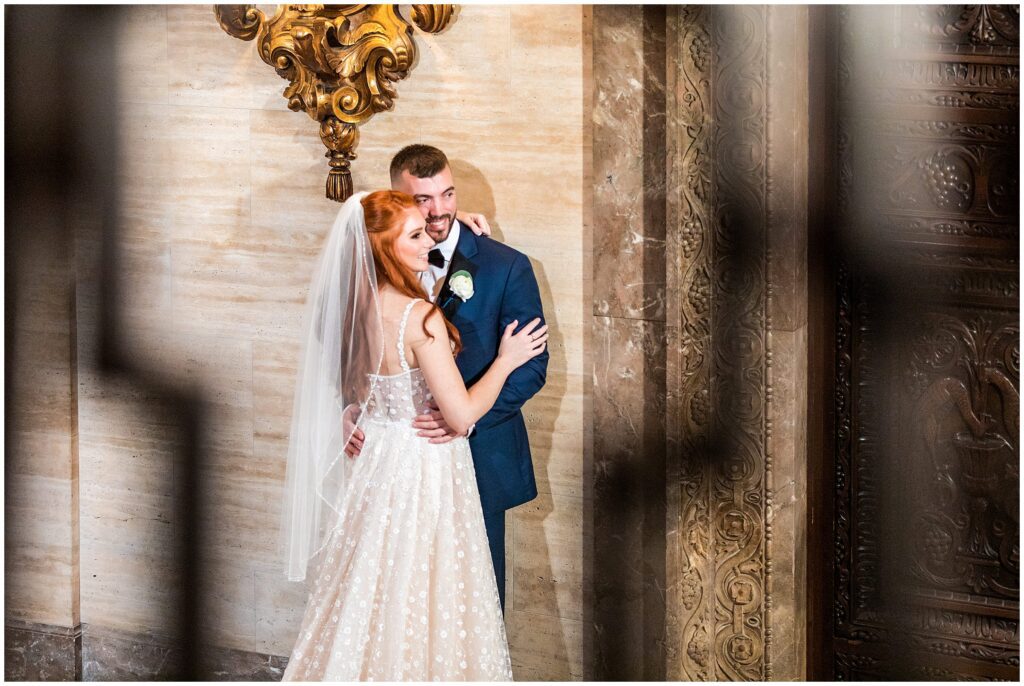 Bride and groom embrace during their first look