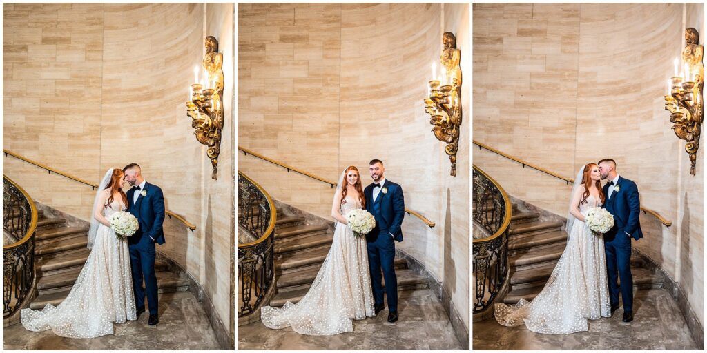 Couple poses on the grand staircase at Hotel DuPont 