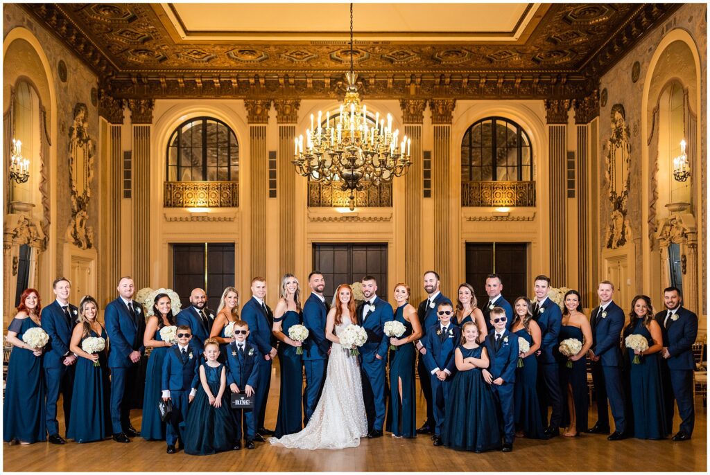 Bride and groom with their wedding party in the Gold Ballroom at Hotel DuPont