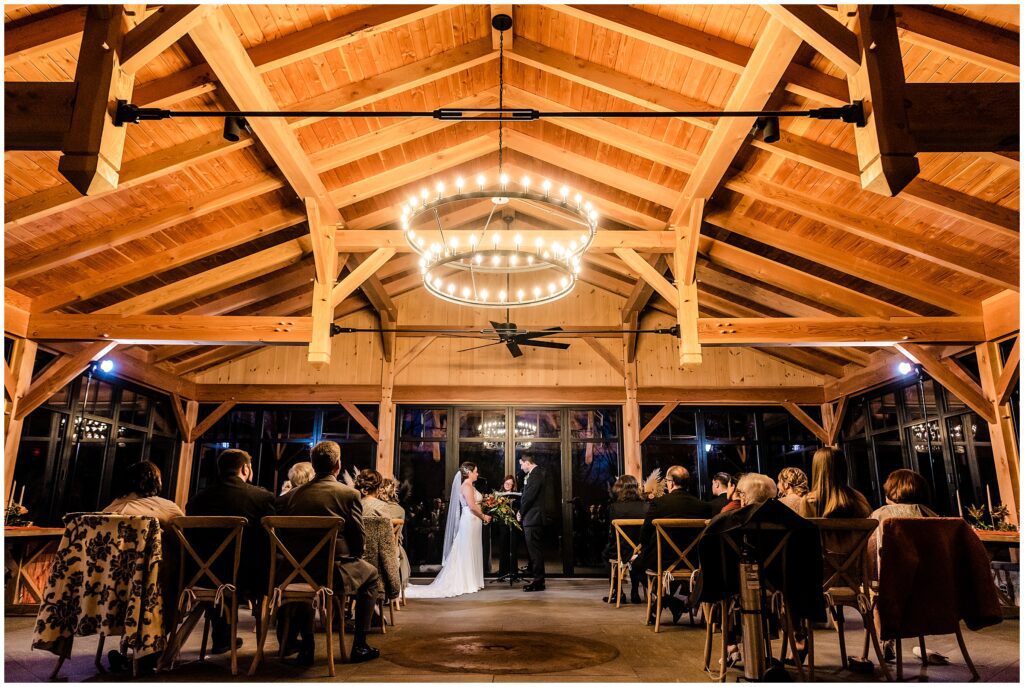 Intimate fall wedding ceremony in the barn at Grace Winery