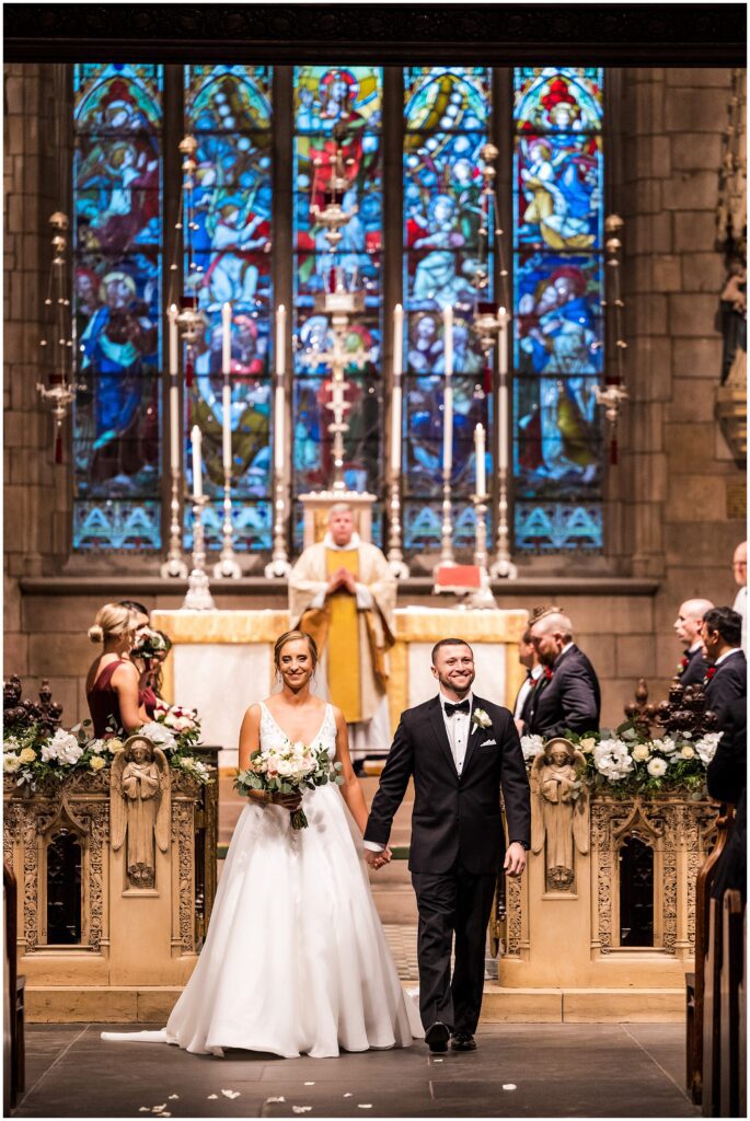 Newlyweds exit their wedding ceremony at St. Mark's