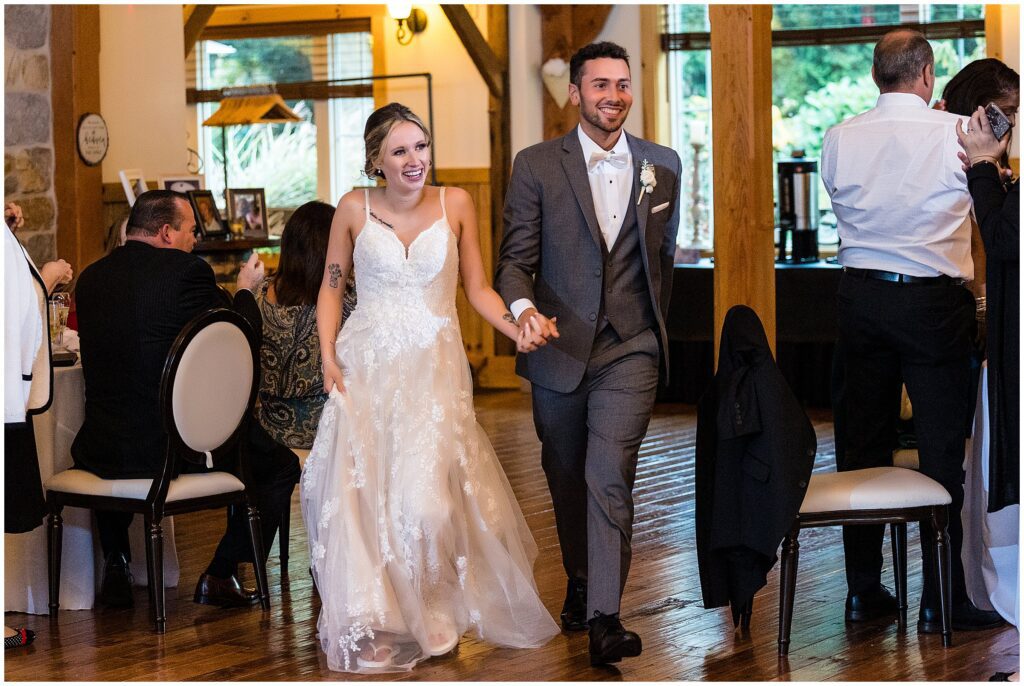 Newlyweds enter their wedding reception