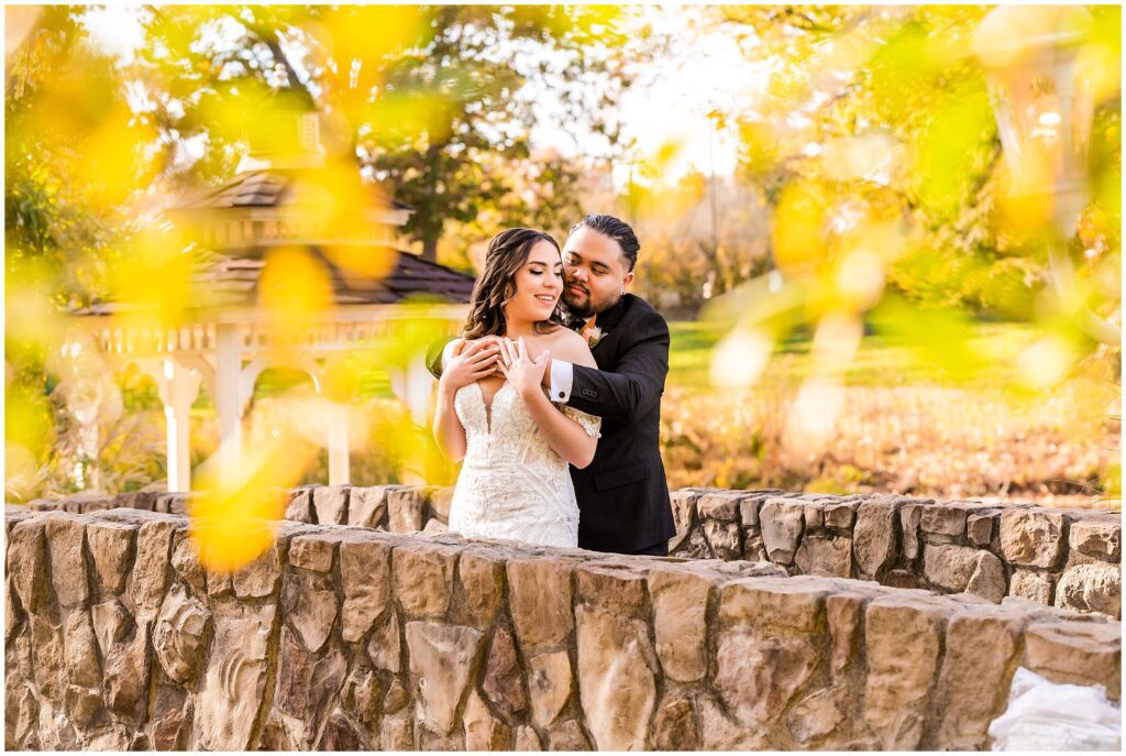 newlyweds embrace on the grounds of Prophecy Creek