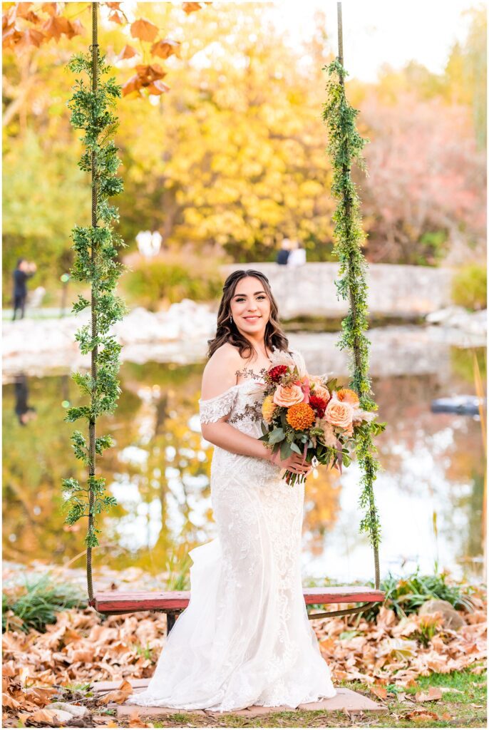 portrait of bride on her fall wedding day near the iconic swing at Prophecy Creek