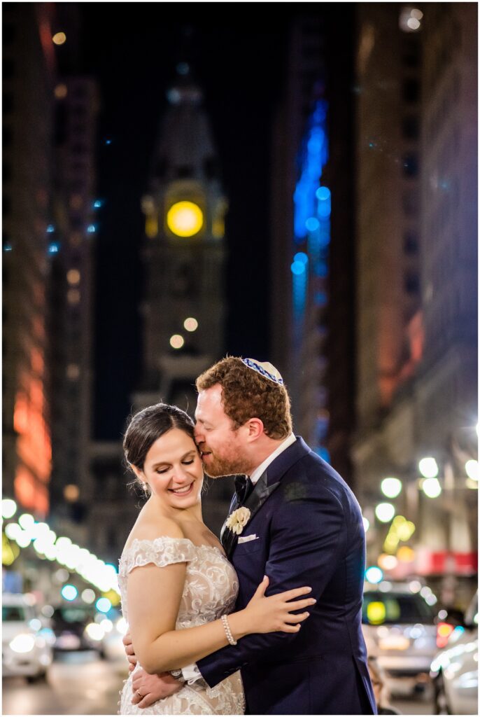 Groom kisses his Bride on Broad St