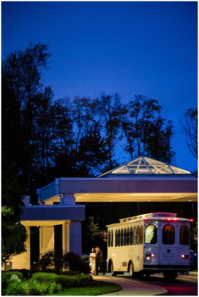 Night photo of bride and groom arriving to their wedding reception at Philadelphia Ballroom | Ashley Gerrity Photography