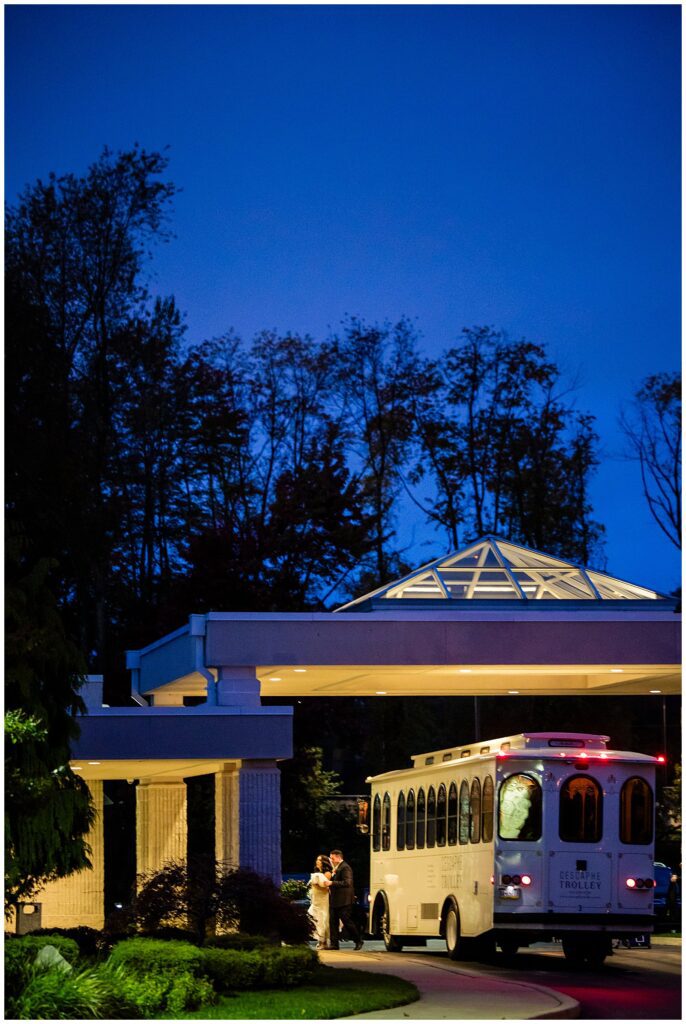 Night photo of bride and groom arriving to their wedding reception at Philadelphia Ballroom | Ashley Gerrity Photography